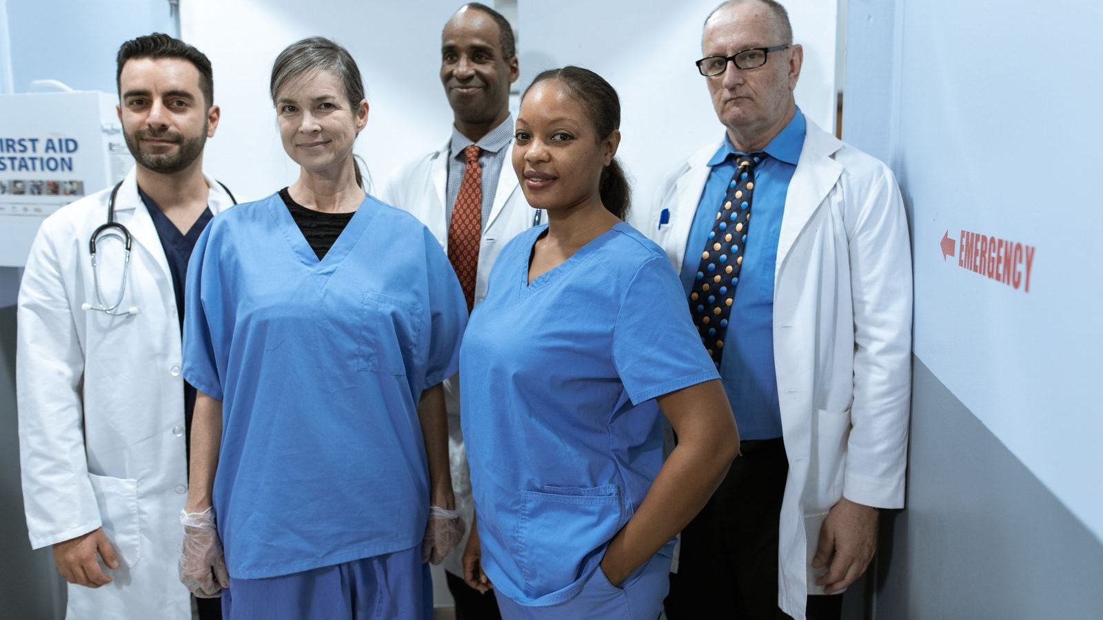 Diverse team of healthcare workers in uniform in a clinical workplace setting