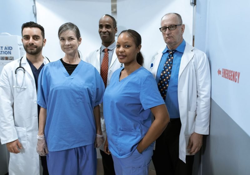 Diverse team of healthcare workers in uniform in a clinical workplace setting