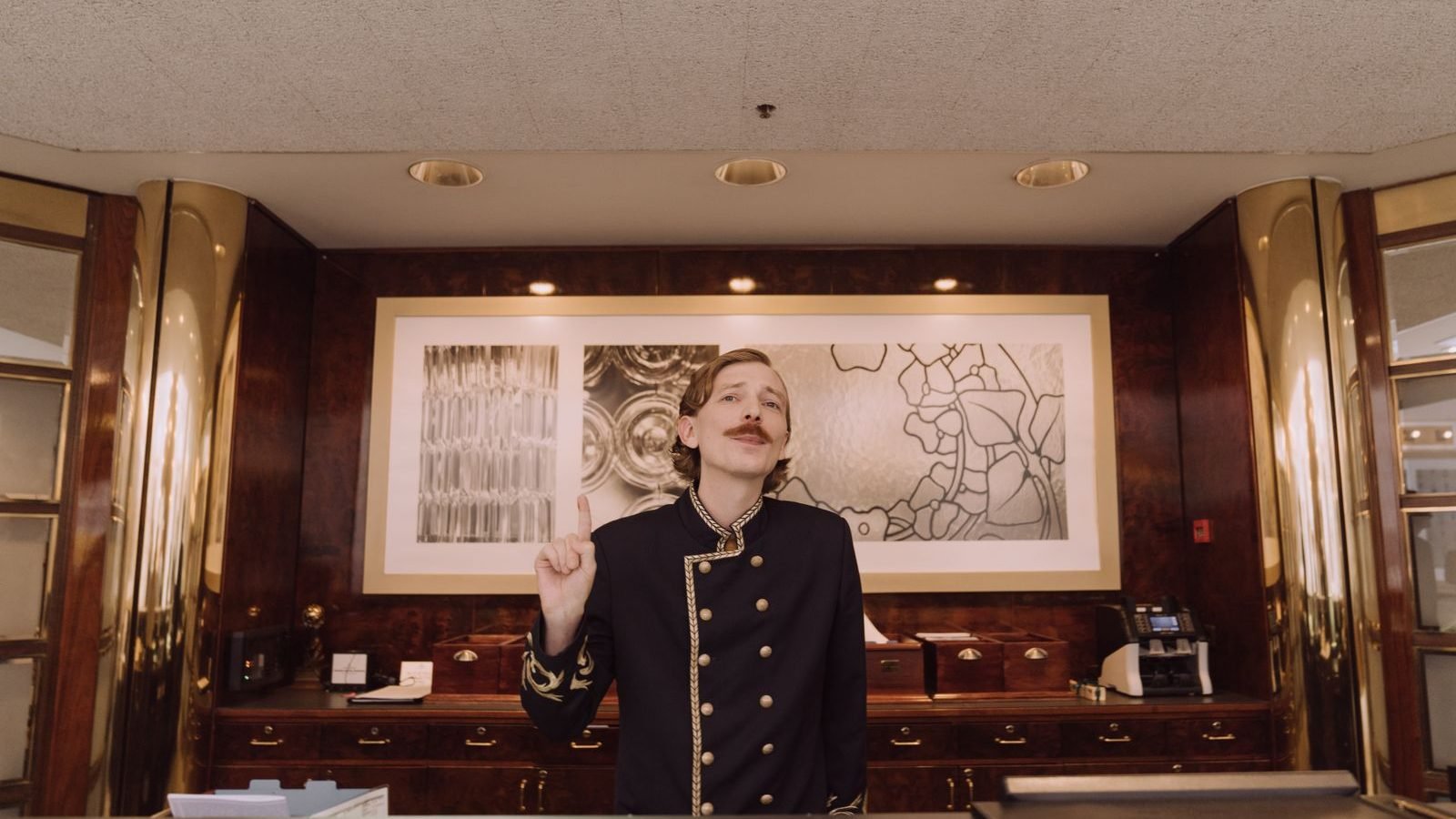 Friendly receptionist at a front desk ready to welcome visitors